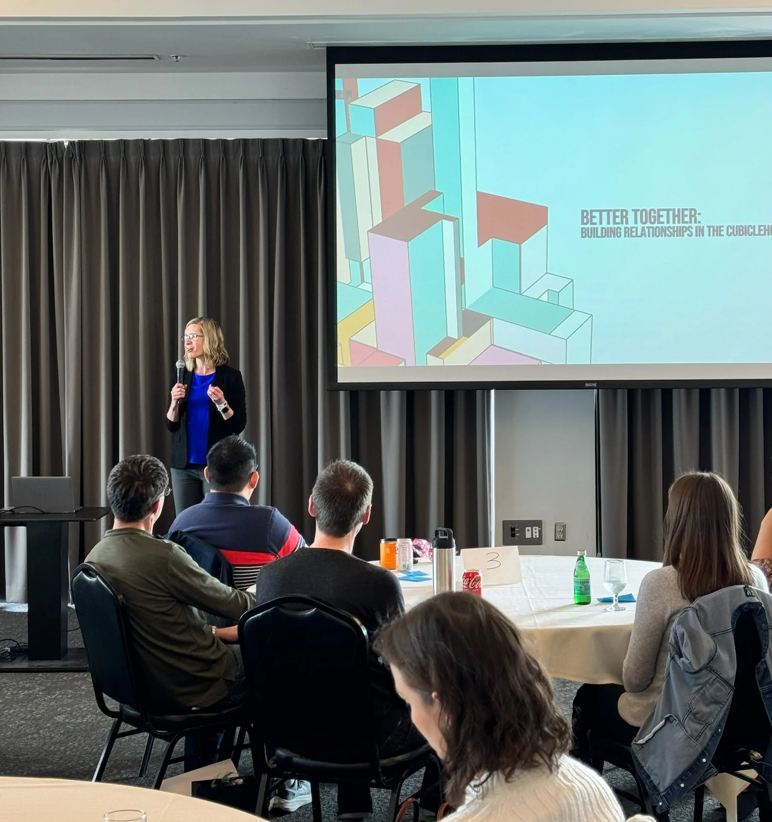 Amber Simonsen presenting to a seated audience